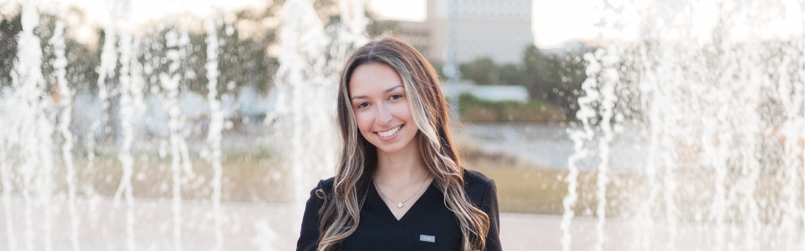 Alexa Isabel Obregon posing in her nursing scrubs