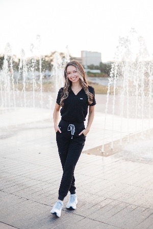 Alexa Isabel Obregon posing in her nursing scrubs