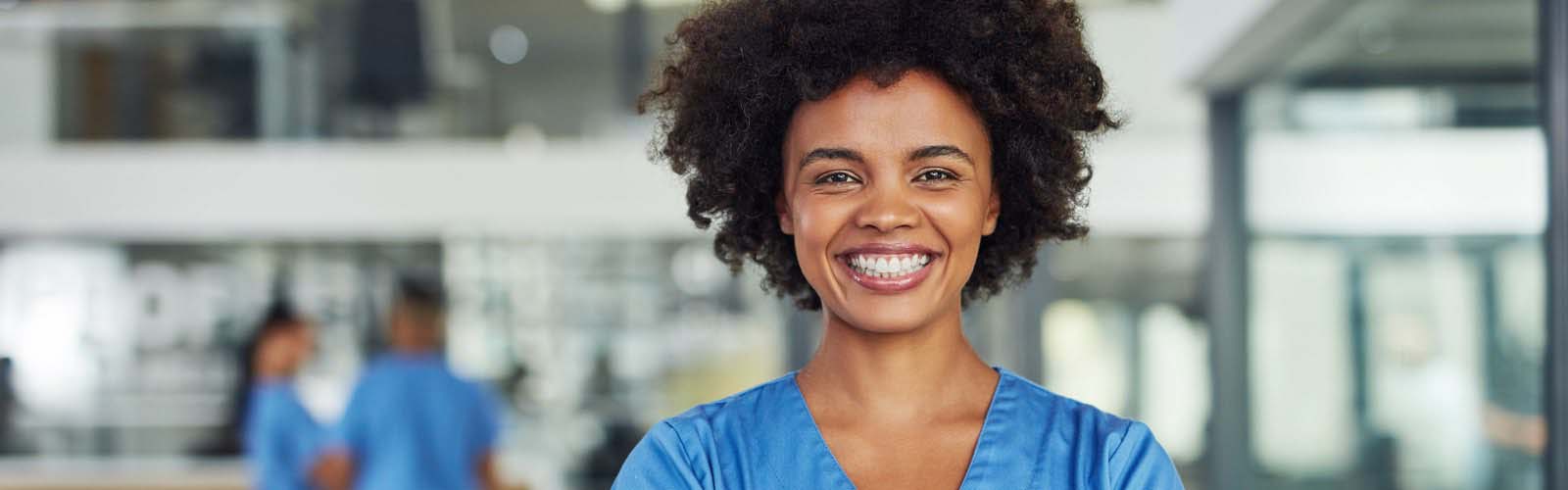Female nurse in hospital smiling
