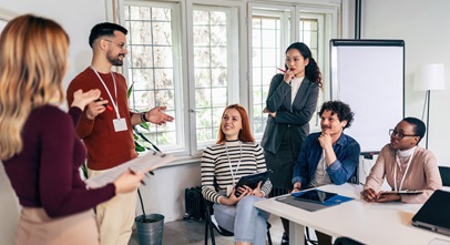 group of professionals working on a project in a conference room