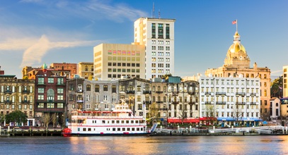 riverboats on the savannah river with the cityscape in the background