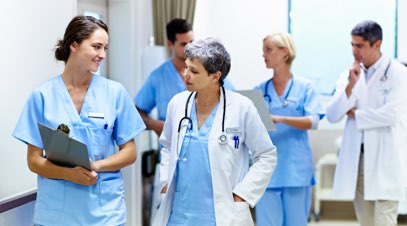 doctor and anesthesiologist assistant walking hallway-alt-text